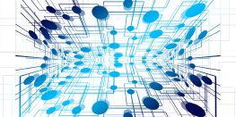 3D network diagram with blue nodes and connecting lines on a white background.