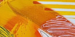 Abstract painting with bold strokes of yellow and red on a textured surface.