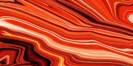 Abstract marbled pattern with swirling shades of red, orange, and white.